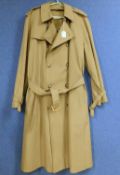 A gentlemans trench coat by Brooks Bros, single breasted with belted waist, size 44 long
