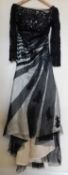 A black and cream gown by Dylan Queen, the cream dress with black net and lace overlay, moulded