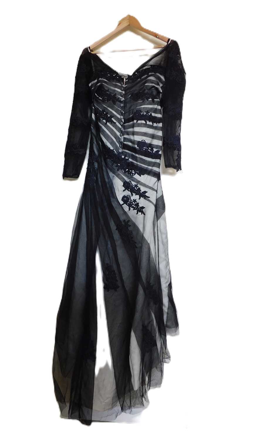 A black and cream gown by Dylan Queen, the cream dress with black net and lace overlay, moulded - Image 2 of 5