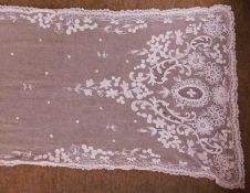 A late 19th/early 20th century machine lace shawl, approx. 50 x 246cm long