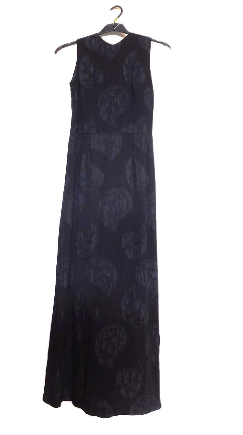 A c.1960's black shift evening dress, with crepe leaf design all over, open back with button