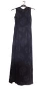 A c.1960's black shift evening dress, with crepe leaf design all over, open back with button