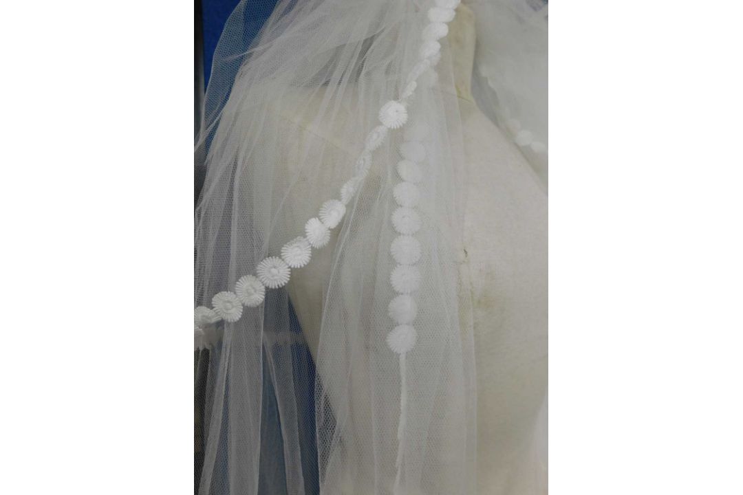 A circa 1960's/70's wedding dress with lace detail to front, frilled cuffs and hem with train - Image 6 of 7
