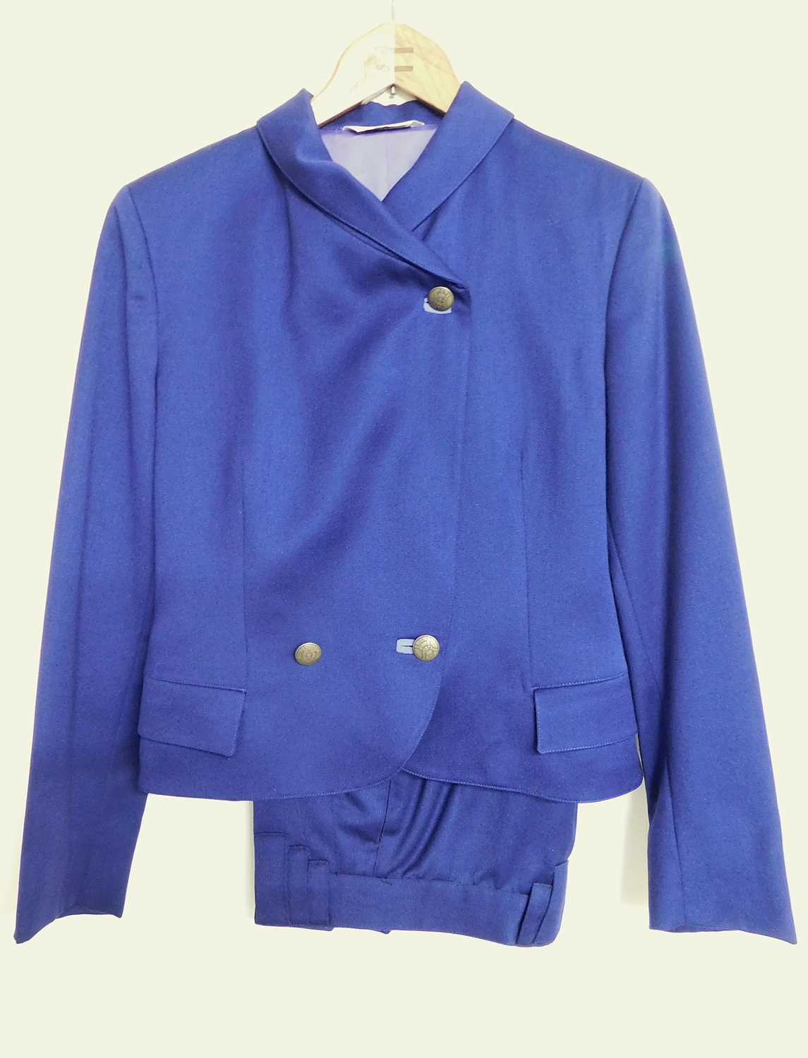 A lady's Versace 'Versus'two piece suit, the crossover button front cropped jacket, withfront flap