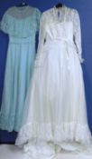 A c.1970's/80's cream wedding dress with ribboned waist, fixed lace overlay jacket, lace hem and