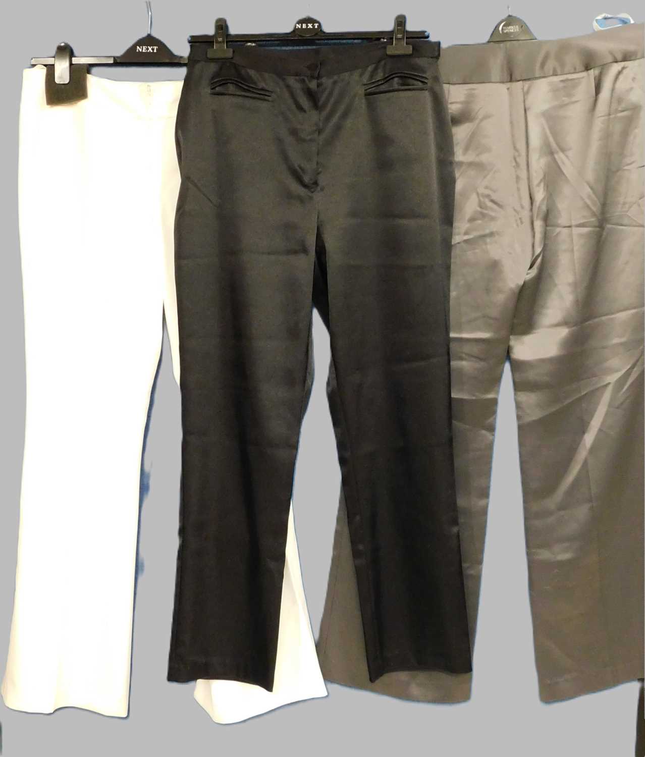 Three pairs of lady's evening trousers, to include a pair of grey satin trousers size 18, a pair