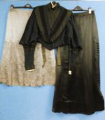 A lady's late Victorian black jacket with high neck and lace trim, deep V neck front with black