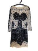 A black and cream beaded cocktail dress, the cream net mesh with strategic sequin detail and