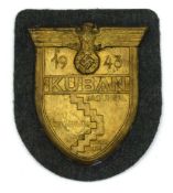 A German Third Reich Second World War Kuban Shield. field grey backing cloth and complete paper