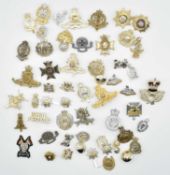 Quantity of ERII Military staybrite cap badges to include Royal Marine Commandos, Royal Artillery,