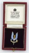 9ct gold SAS 22 Regiment badge by Garrards & Co with blue enameling to front, together with original