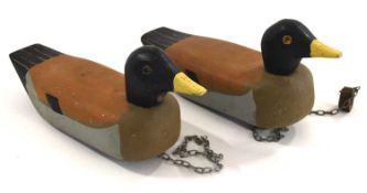 Two mid 20th century contemporary hand painted wooden mallard duck decoys with chains to base.