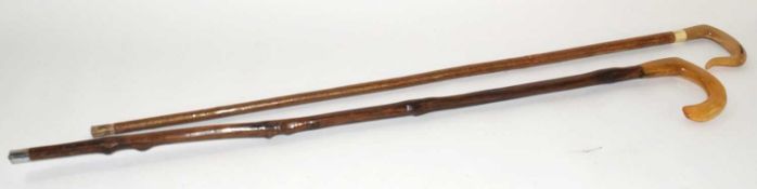 Two shepherds crooks/ walking sticks / stalking sticks with horn handles. One example with worked