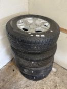 Four Ford alloy rims with tyres