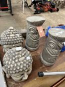 Mixed lot of four garden statues, two totem and two Buddha heads