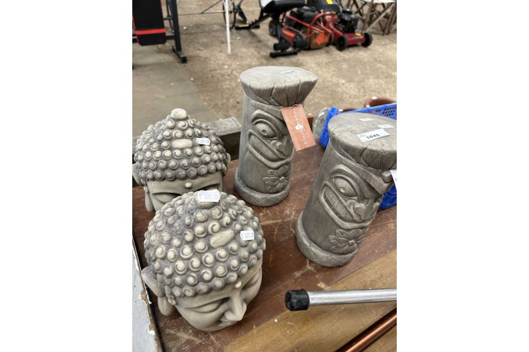Mixed lot of four garden statues, two totem and two Buddha heads