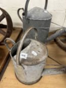Two galvanised watering cans