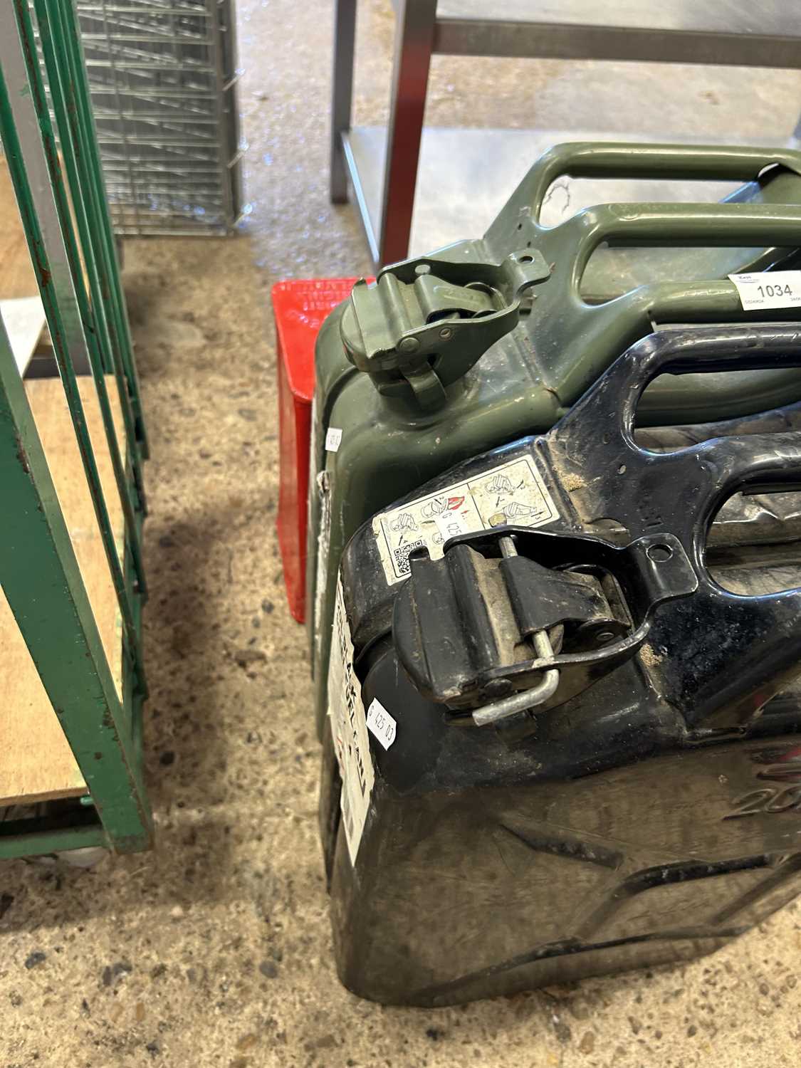 Two 20 litre jerry cans together with one other