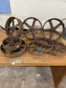 Mixed lot of eight various sized cast iron wheels