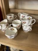 Quantity of Coalport floral decorated coffee cups and saucers
