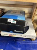 A Medtronic Patient Monitor, boxed together with a set of electronic bathroom scales