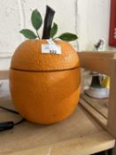 A novelty orange ice bucket