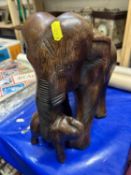 A hardwood model of mother and baby elephant
