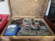 Wooden box containing a quantity of model railway items, track, transformer etc