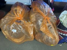 Two plastic bags containing a quantity of wool