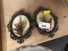 Two pressed flower pictures in metal oval frame