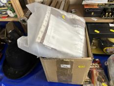 A box of various assorted singles and a quilting cushion