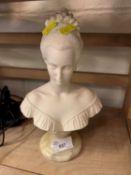 Composition bust of a young lady