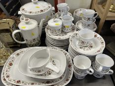 A collection Noritake Progression china comprising dinner plates, serving plates, tureen, cups,