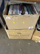 Two boxes containing a large quantity of various DVD's