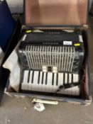 A Hohner student VM accordion in case
