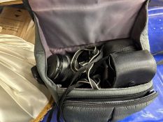 A Canon EOS 620 camera together with light shades