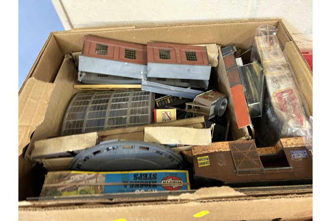 An Airfix multiple train control system together with a box with various train accessories,