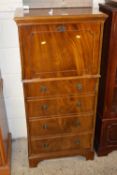 A modern mahogany veneered drinks cabinet with drop down front