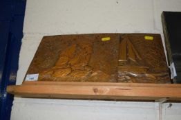 A pair of pressed copper wall plaques