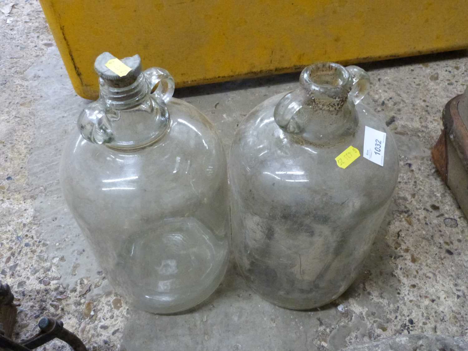 Two glass demi johns