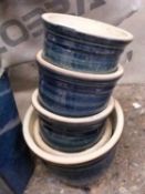 Five circular blue glazed plant pots
