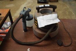 A fencing pump and spray gun