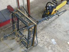 A large late 19th or early 20th Century iron hanging light fitting with square formed base with