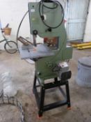 A Dewalt electric band saw and accompanying stand