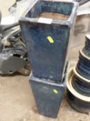 A pair of narrow blue glazed plant pots