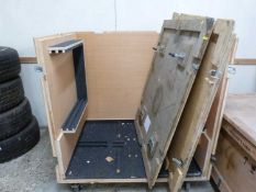 A large plywood packing crate on wheels