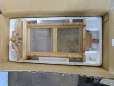 A modern oak wall clock case, lacking movement