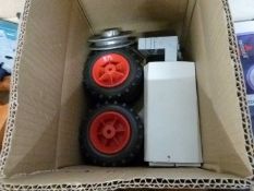 Box of mixed items to include small implement wheels, boxes of wall plugs etc