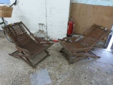Two hardwood garden recliners
