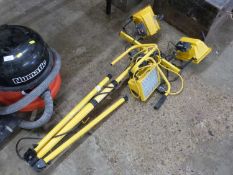 A double floodlight on tripod base plus one other (2)